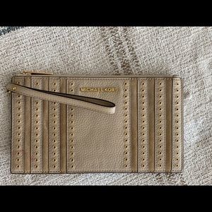 Michael Kors studded garnet wristlet.